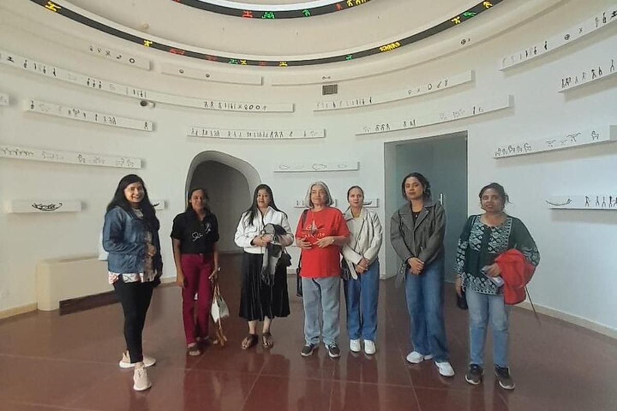 a group of women standing in a large room
