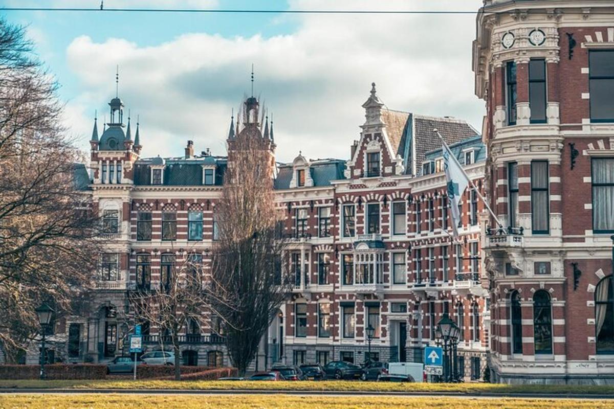 a large building with a clock tower in front of it