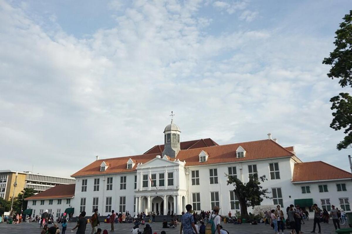 a large white building with a red roof
