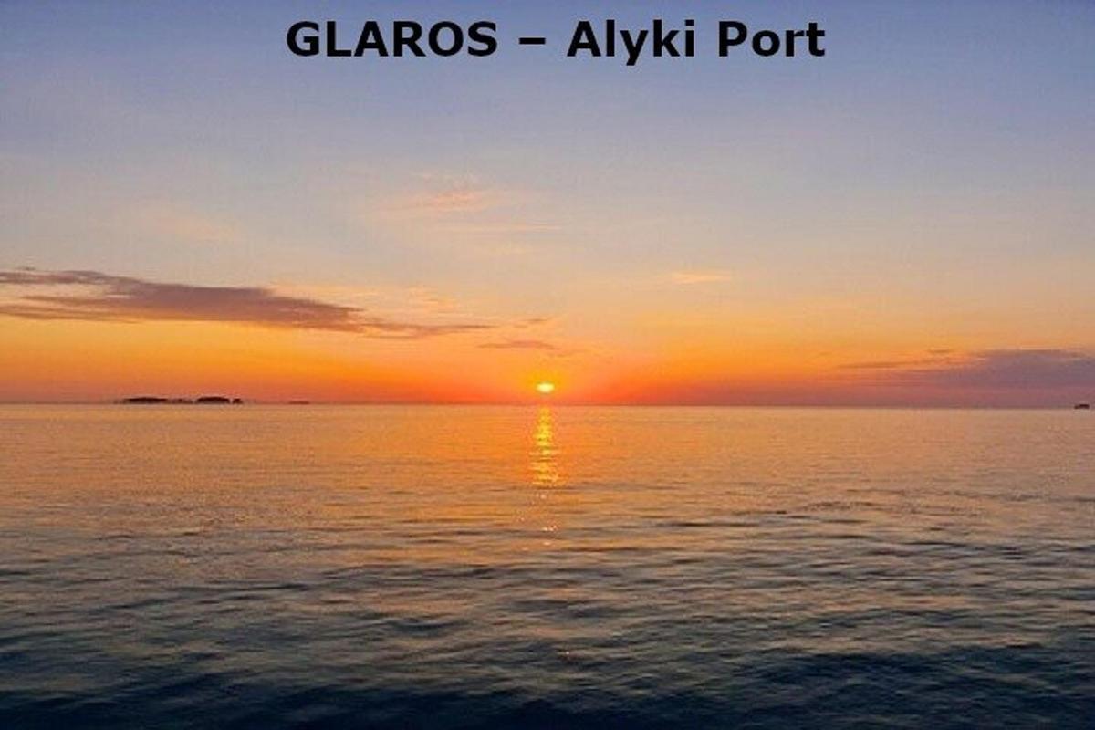 a sunset over the ocean with the sun in the sky