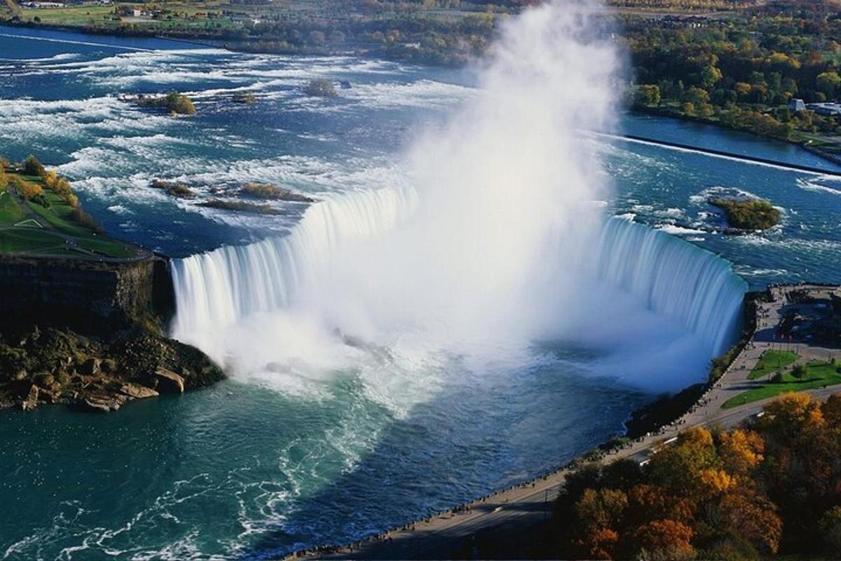 an aerial view of a waterfall in a river