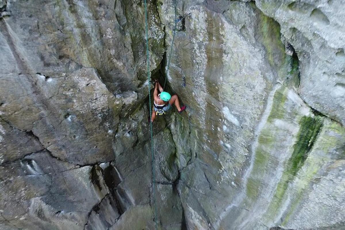 a person is climbing on a rock wall