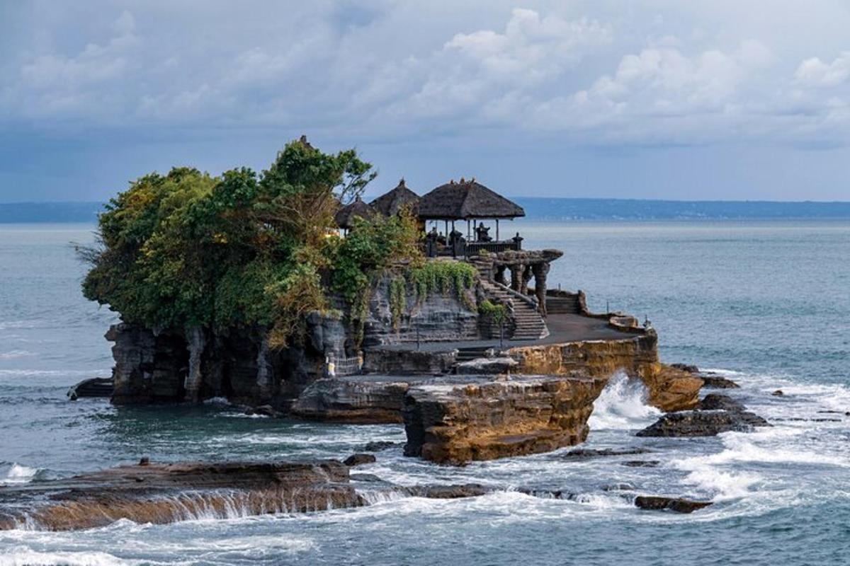 an island in the ocean with a building on it