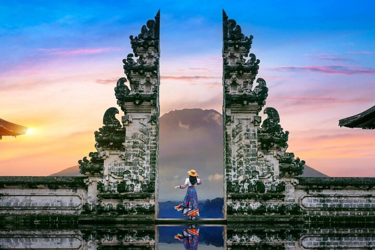 a painting of a woman standing between two towers