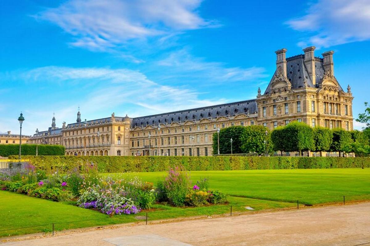 a large building with a garden in front of it