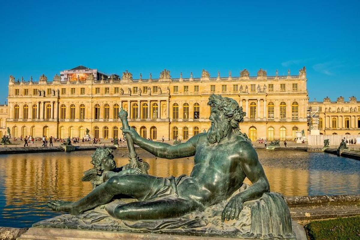 a statue in front of a large building