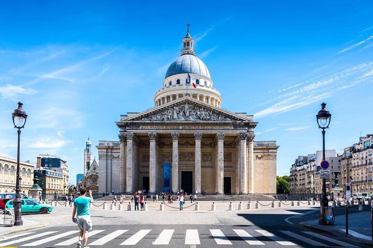 a man is walking in front of a building