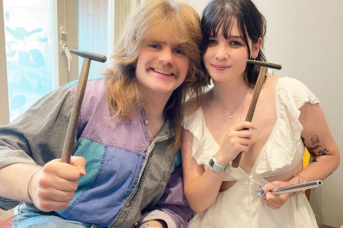 a man and a woman holding chopsticks