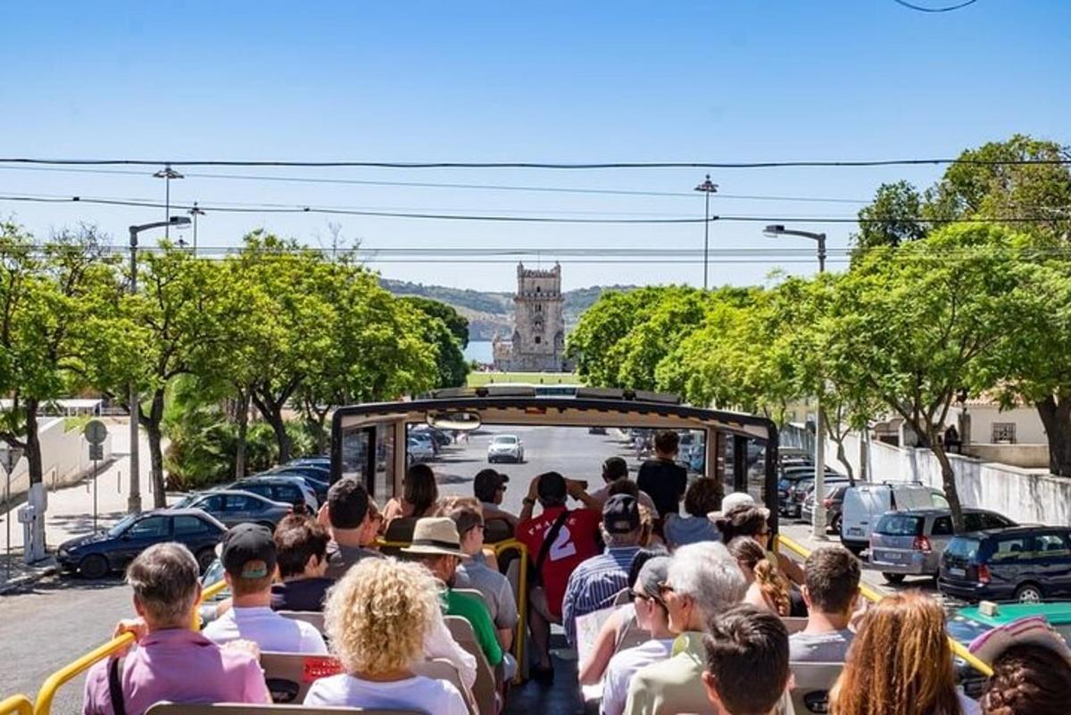 a group of people riding in a trolley