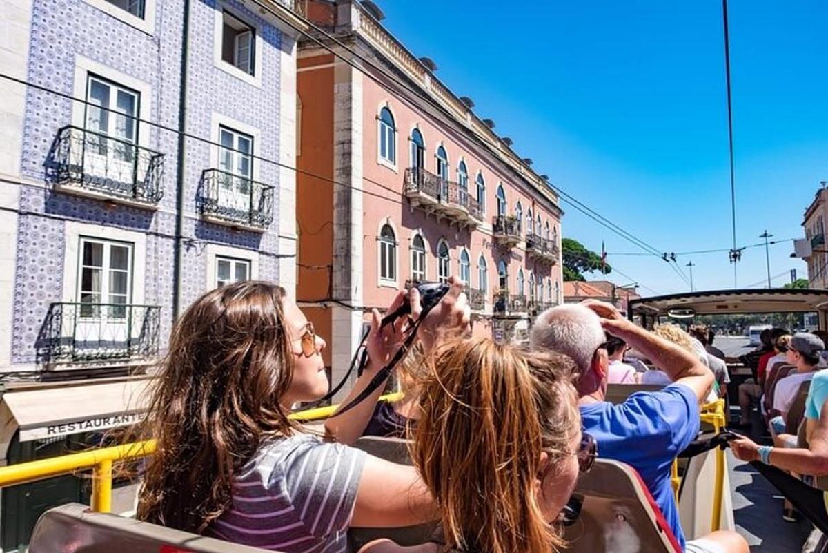 a group of people taking pictures on a bus