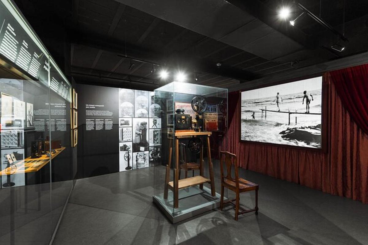 a display case in a museum with a wooden chair