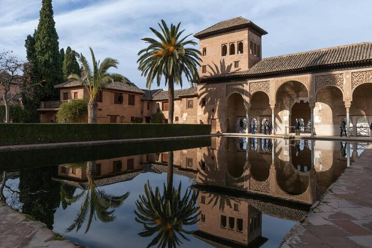 a reflection of a building in a pool of water