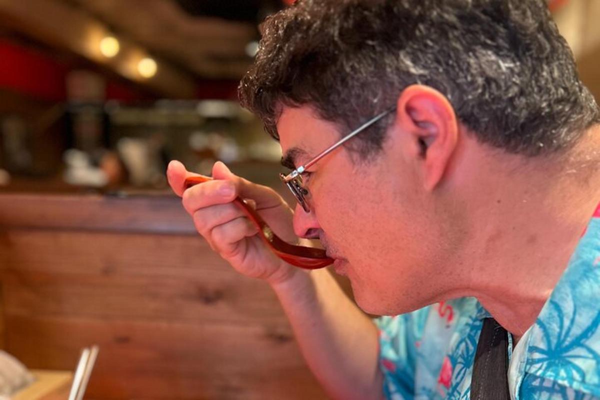 a man with a spoon in his mouth