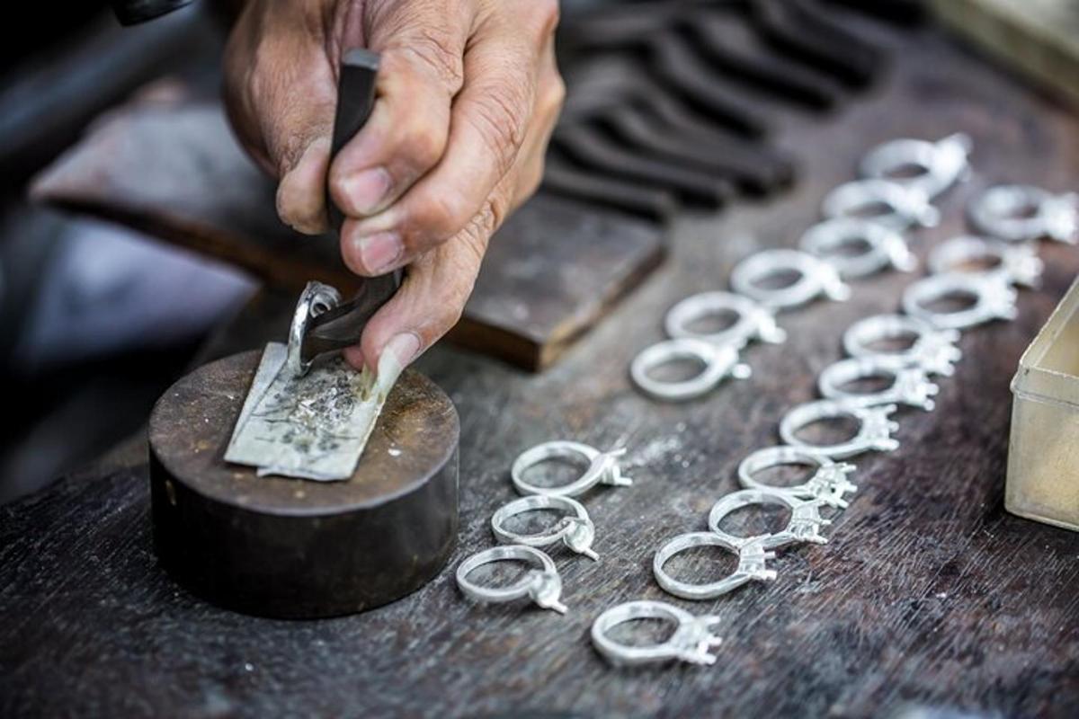 a person using a pair of scissors on a table