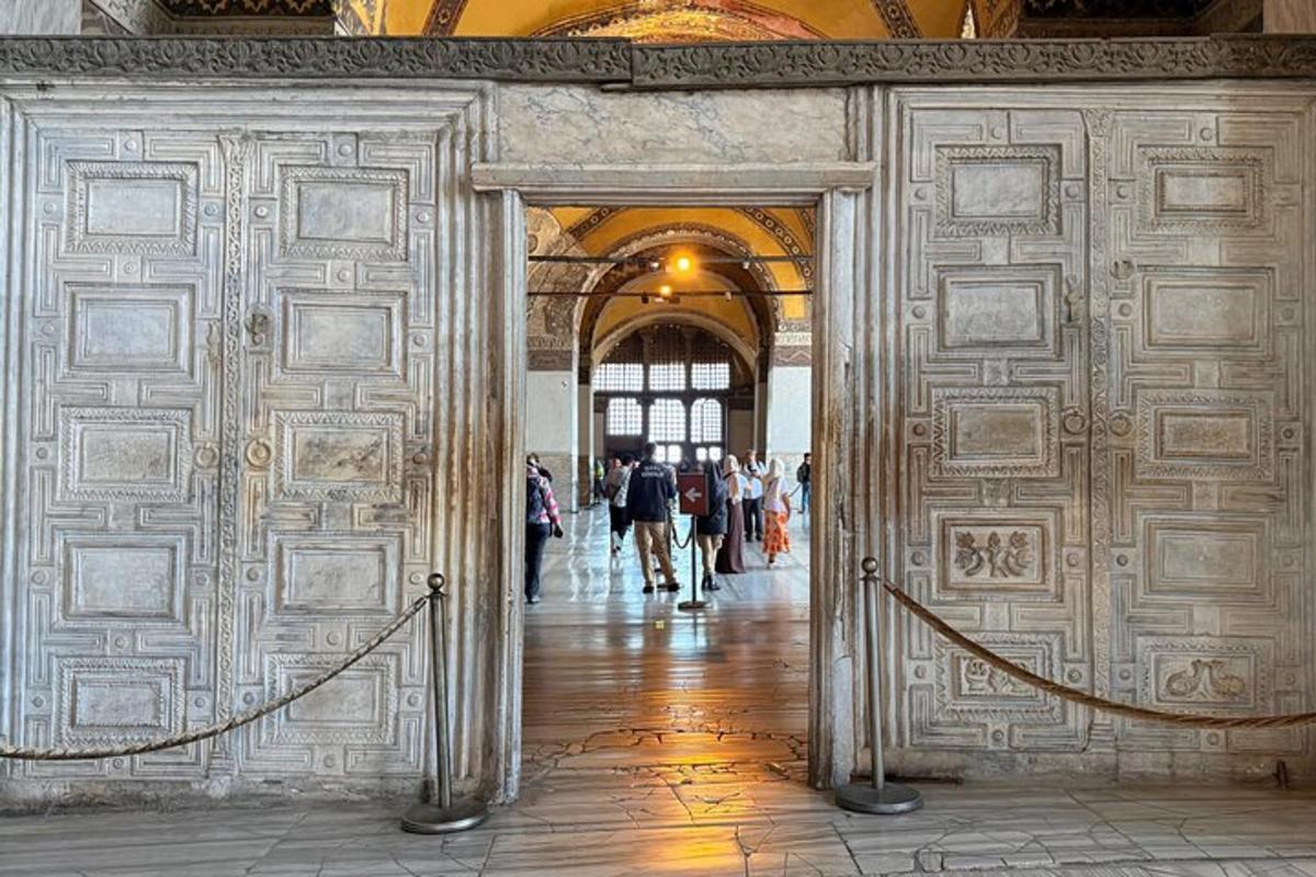 a hallway in a building with people walking through it