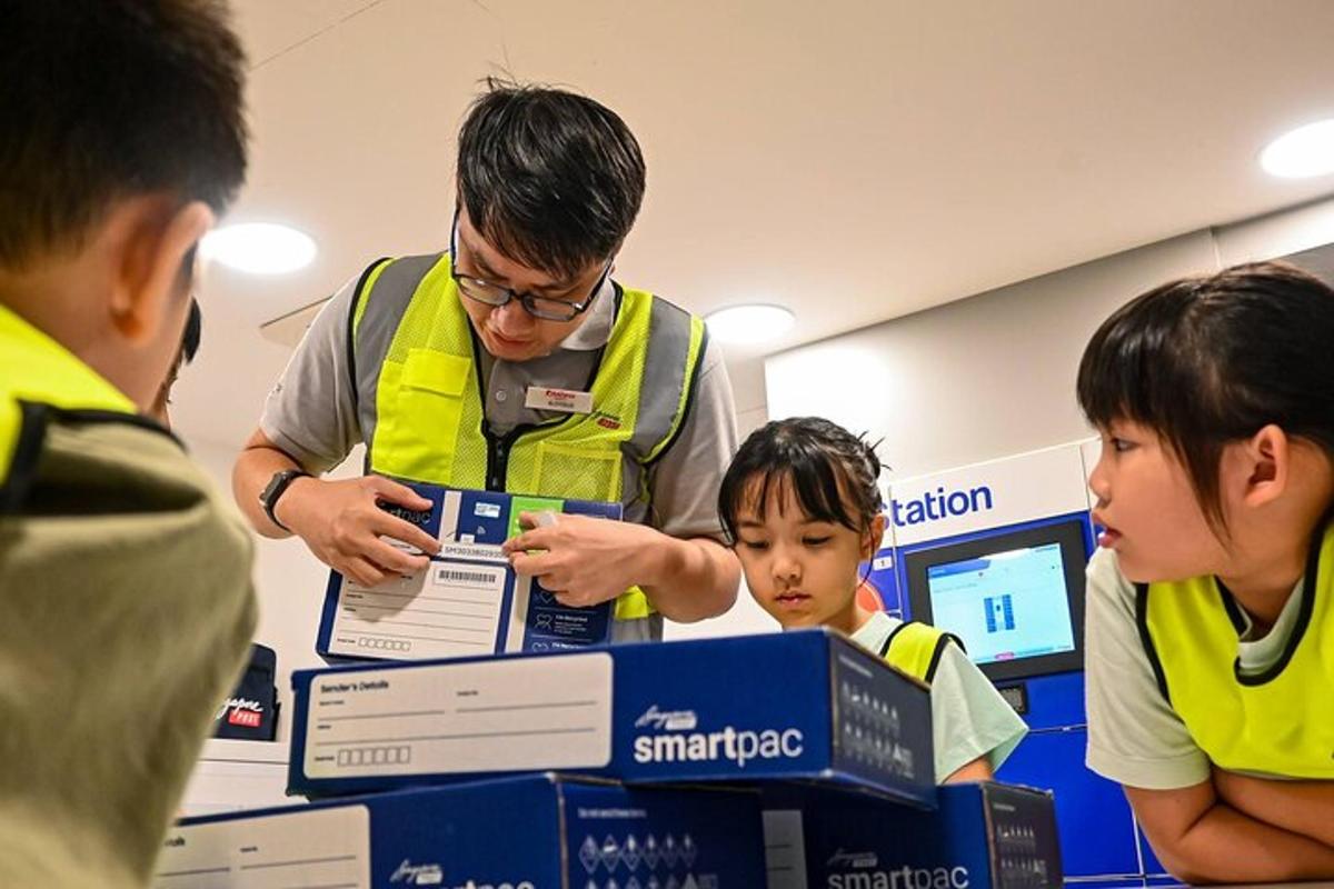 a man and two children looking at a box