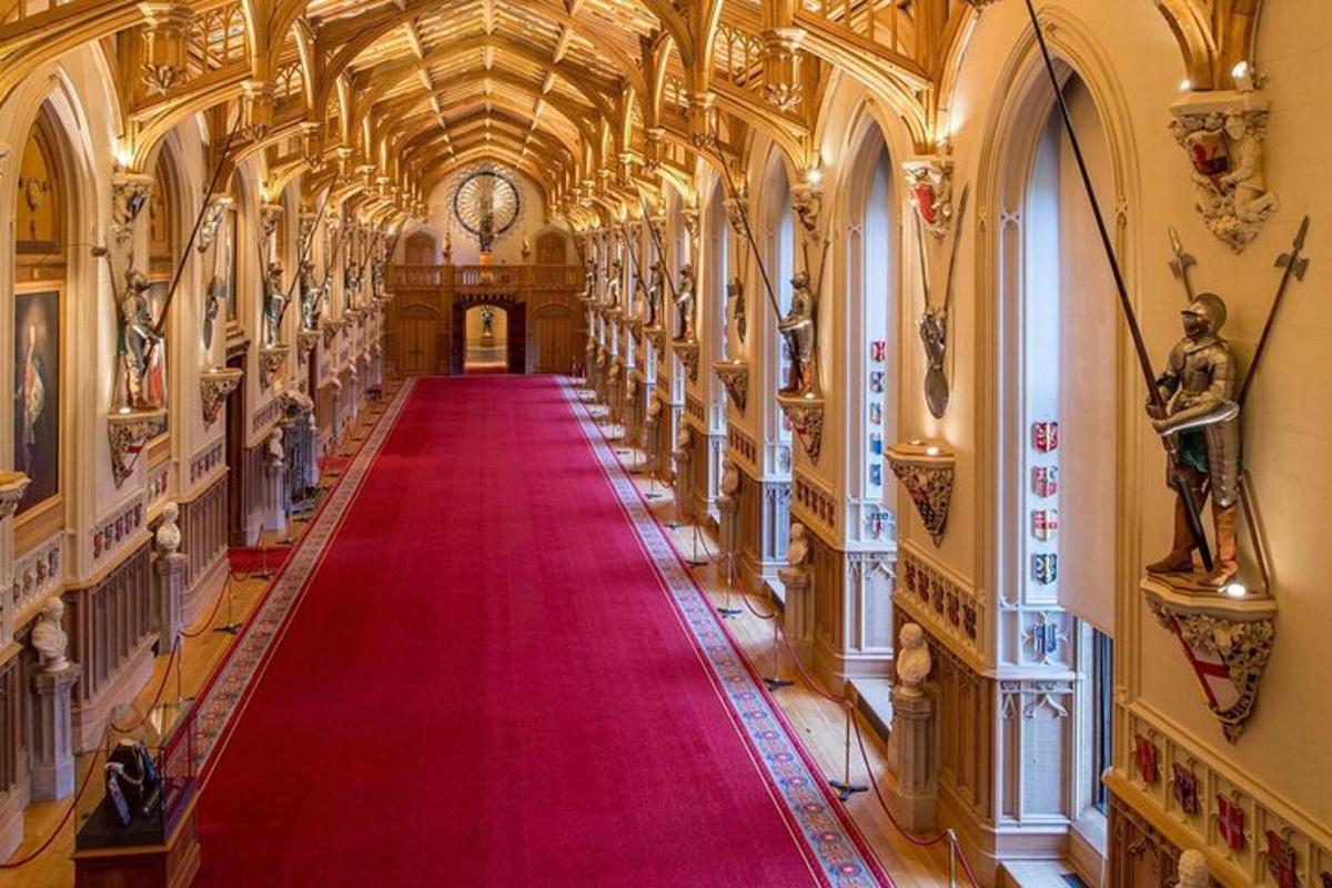 a large hallway with a red carpet in a building