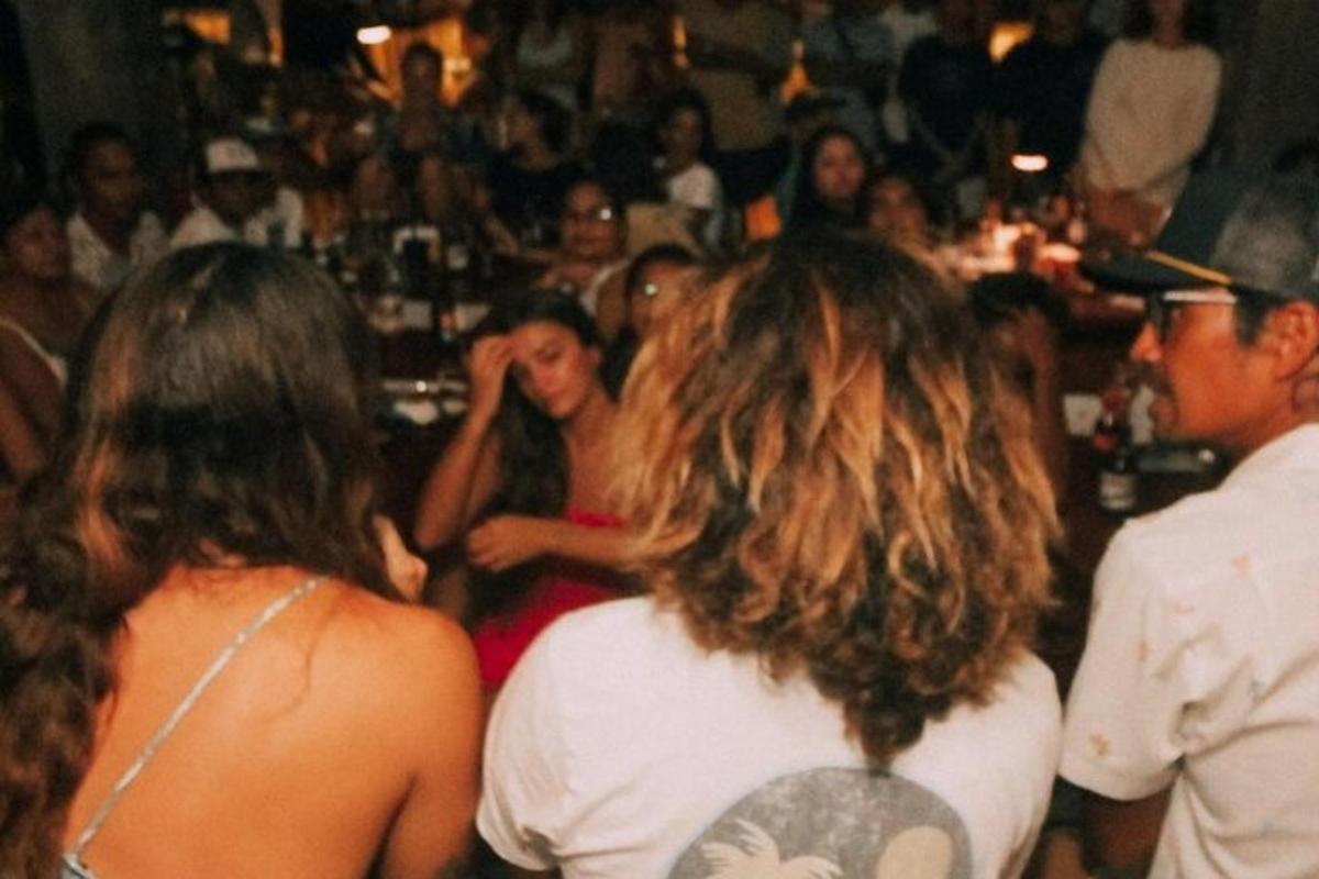 a group of people standing in a party