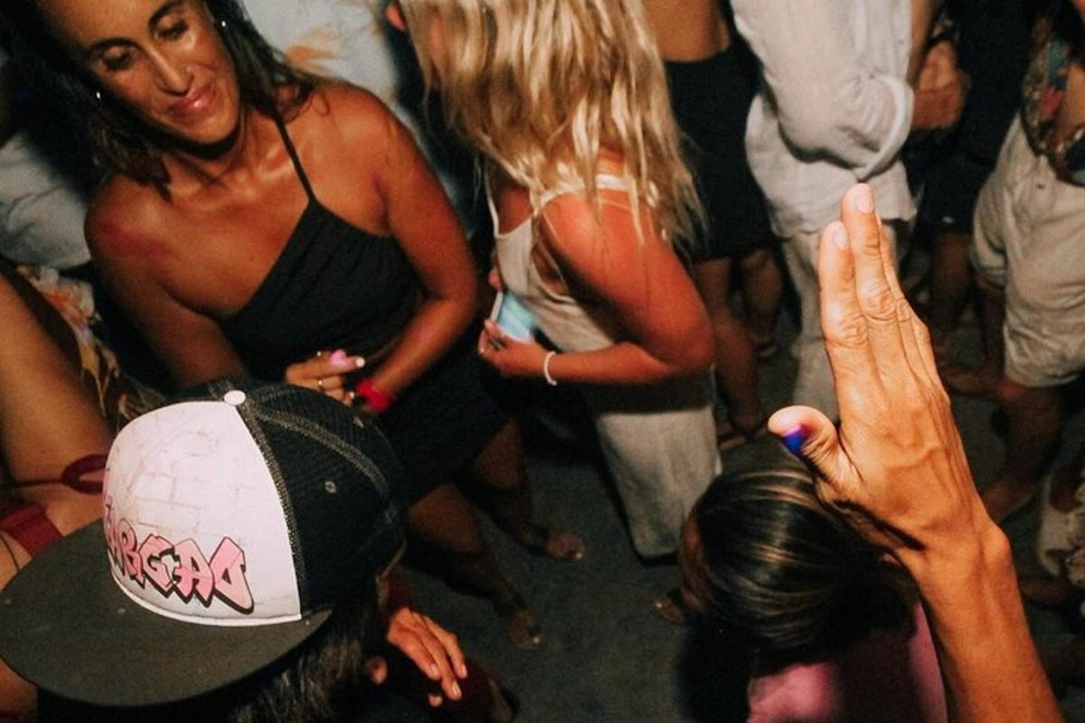 a group of people standing around at a party