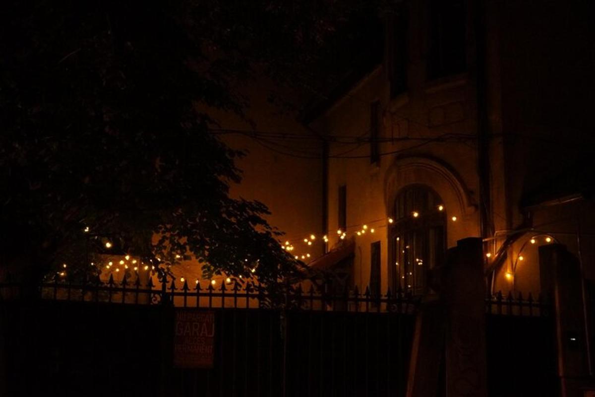 a building with christmas lights on it at night