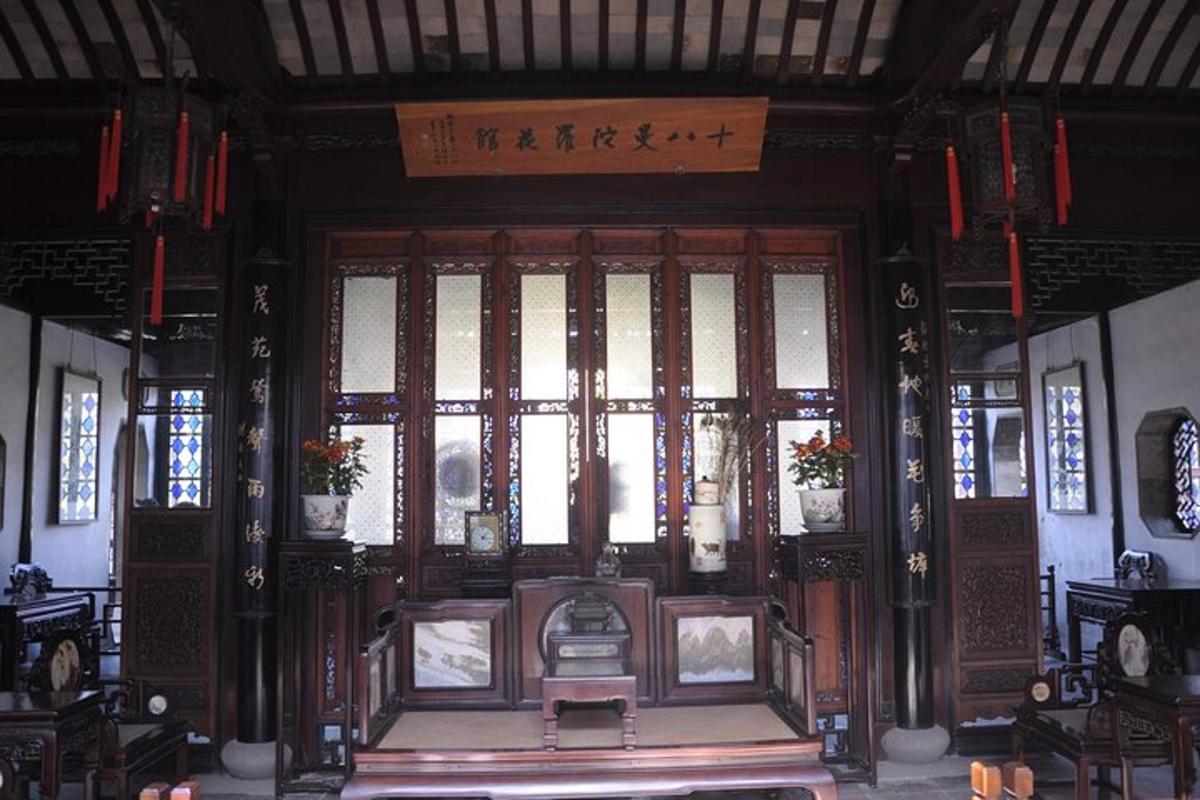 a large wooden door with a window in a building