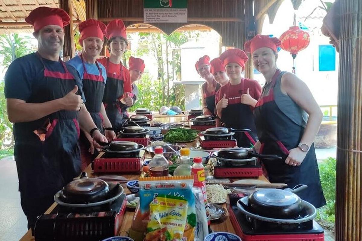 a group of people standing in front of a table with food