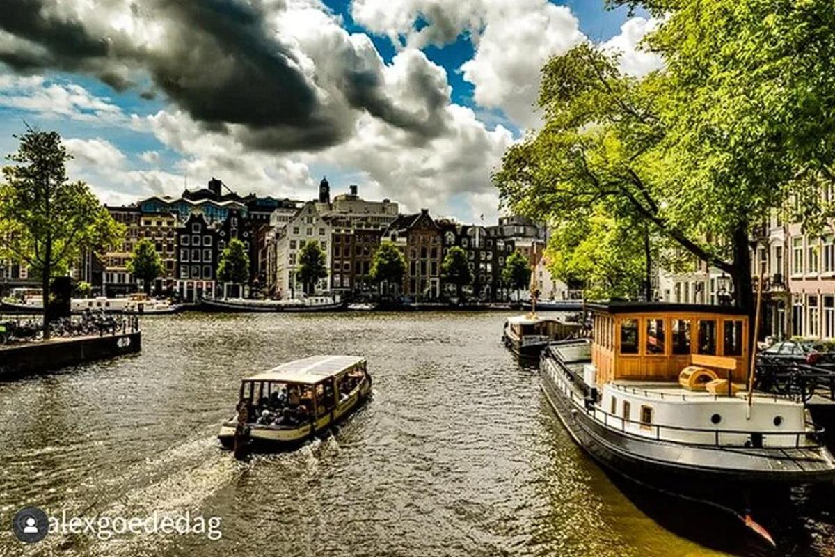 two boats on a river in a city