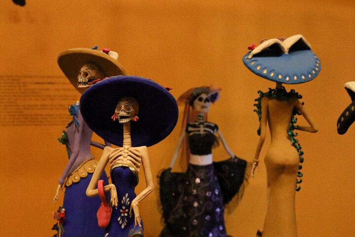 a group of mannequins wearing skeletons and hats on display