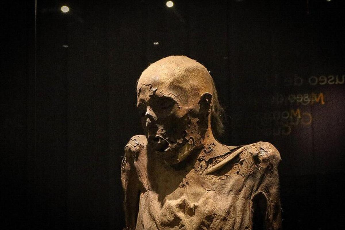 a statue of a man with his hand up
