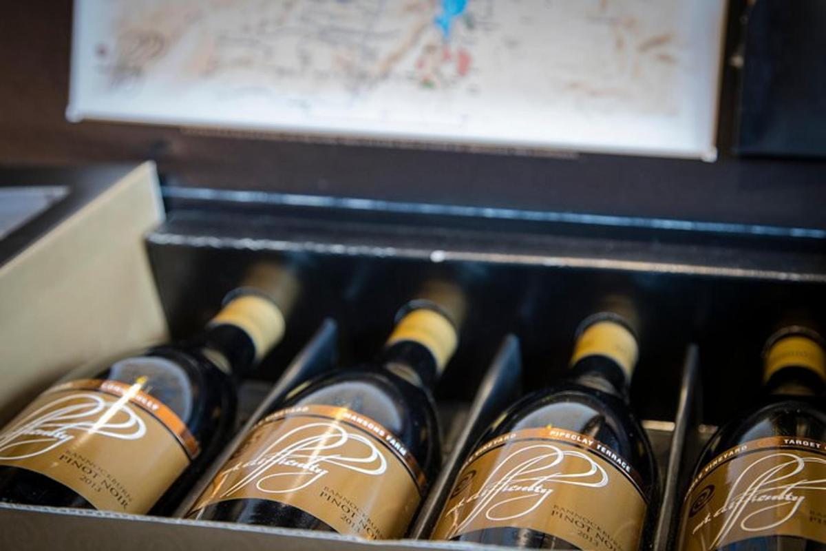 a box full of bottles of wine in a drawer
