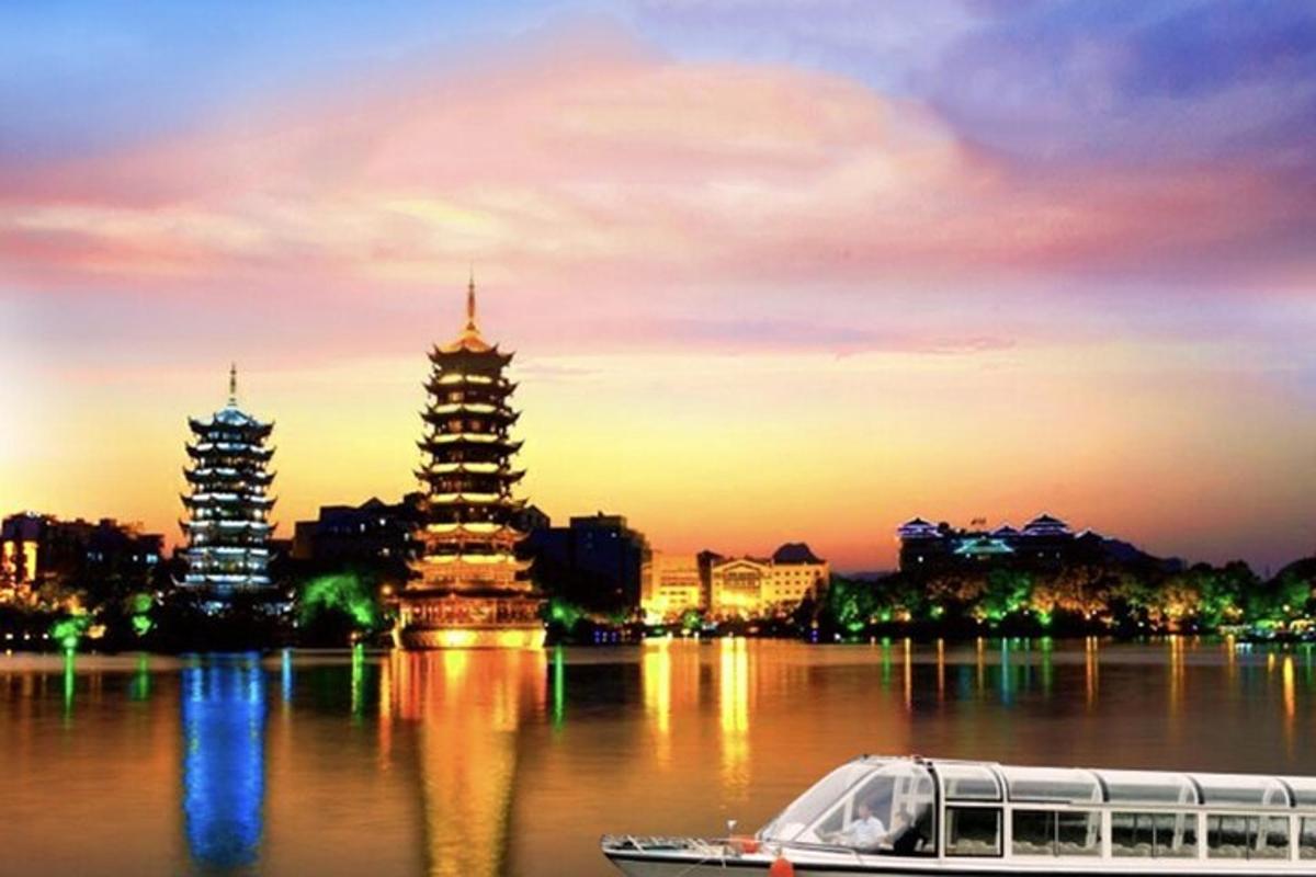 a boat in the water in front of a city