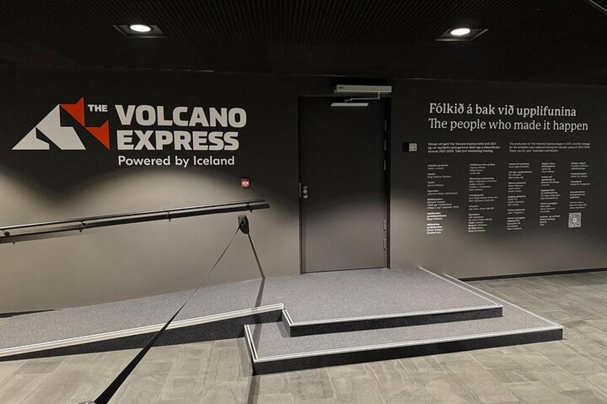 a room with a exhibit with a ramp and a sign