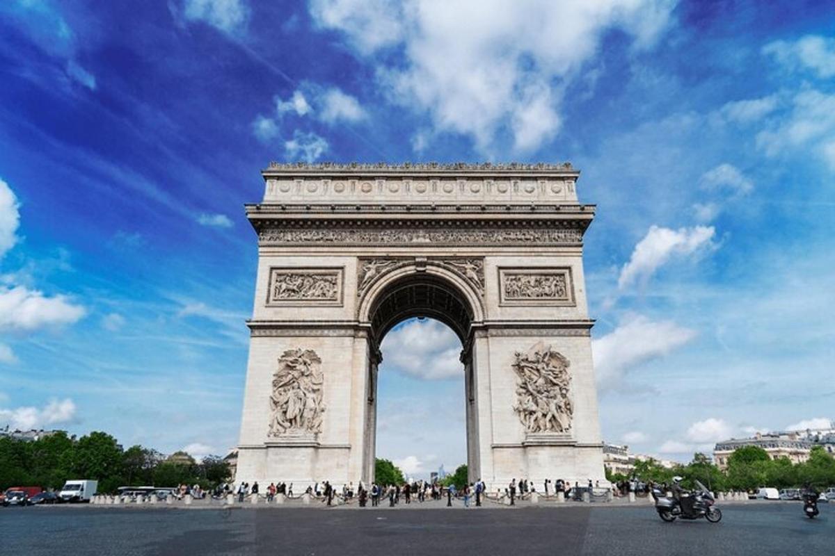 a large monument with people standing around it