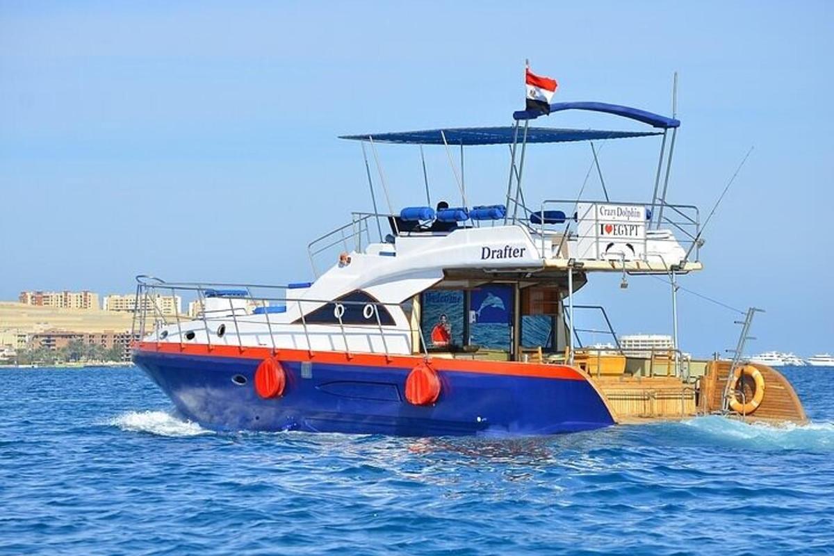 a blue and orange boat in the water