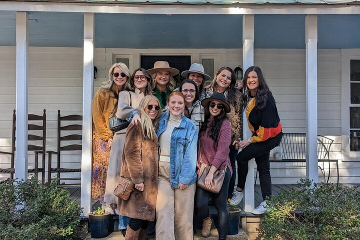 a group of people posing for a picture on a house