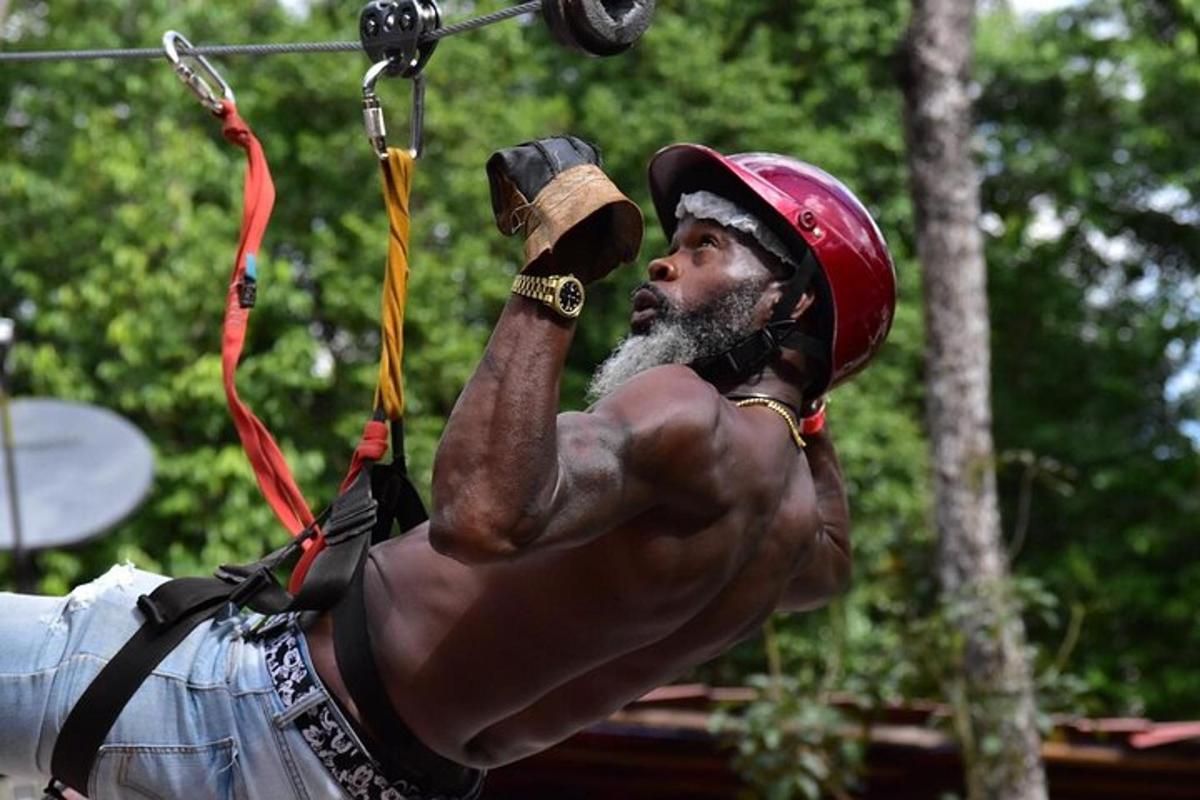 a man with no shirt on holding a bow