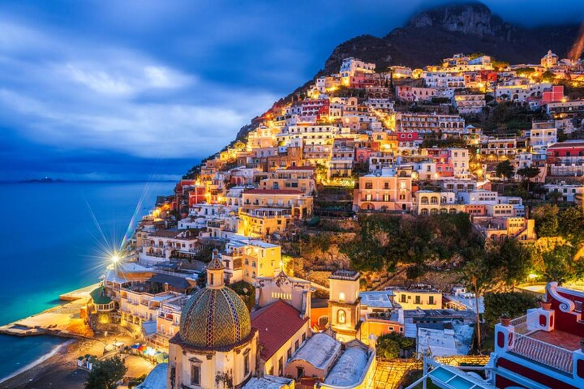 a view of positano on the amalfi coast at night