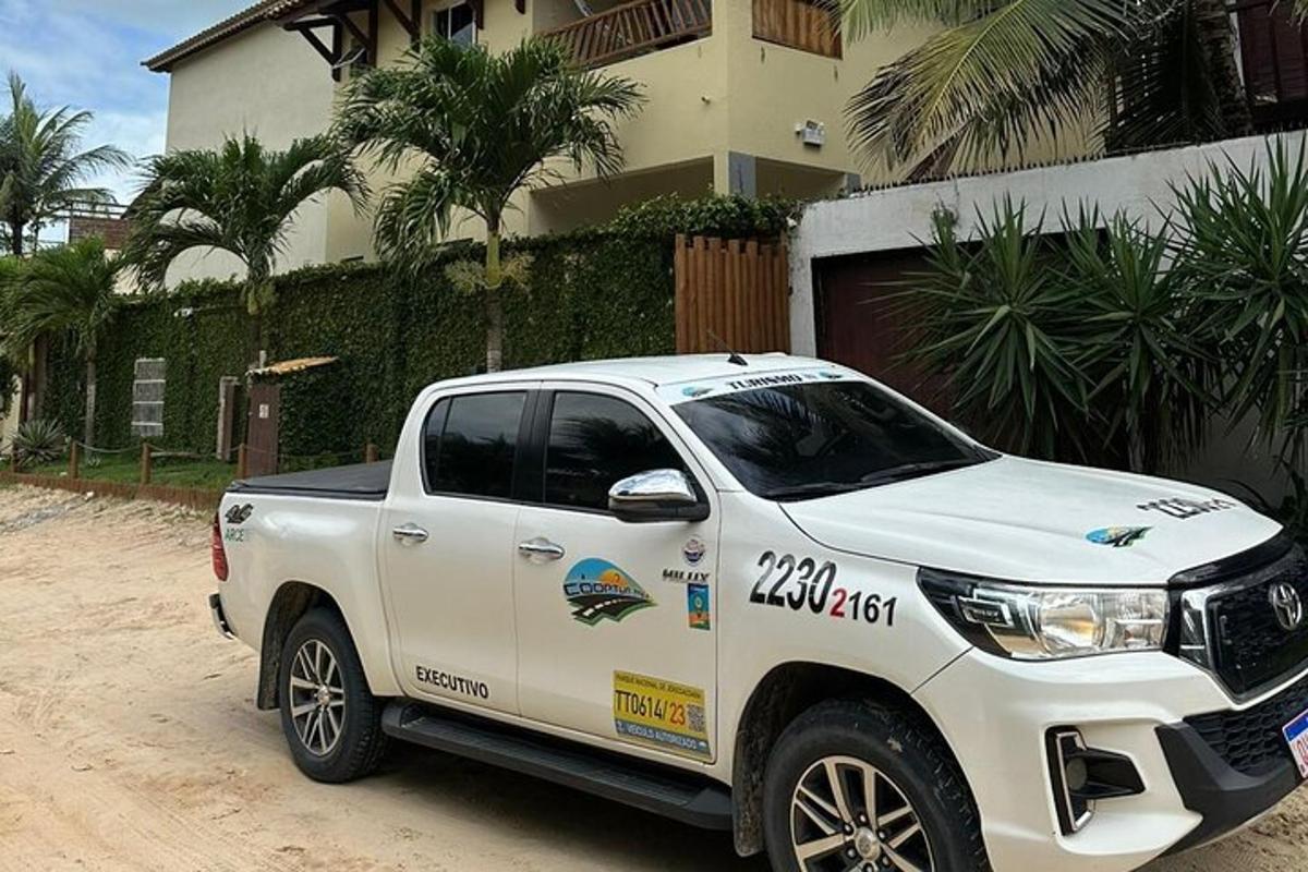 a white truck parked in front of a house