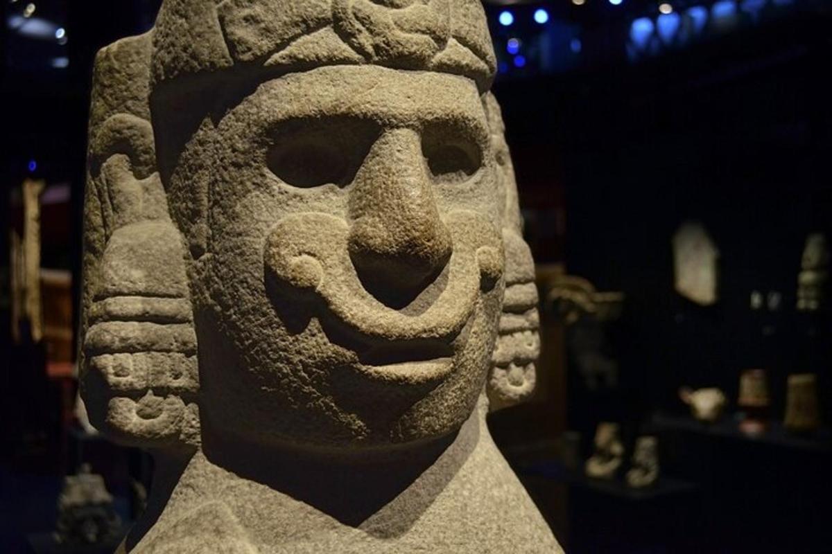 a statue of a head in a museum