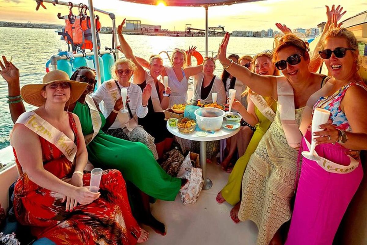 a group of women are sitting on a boat