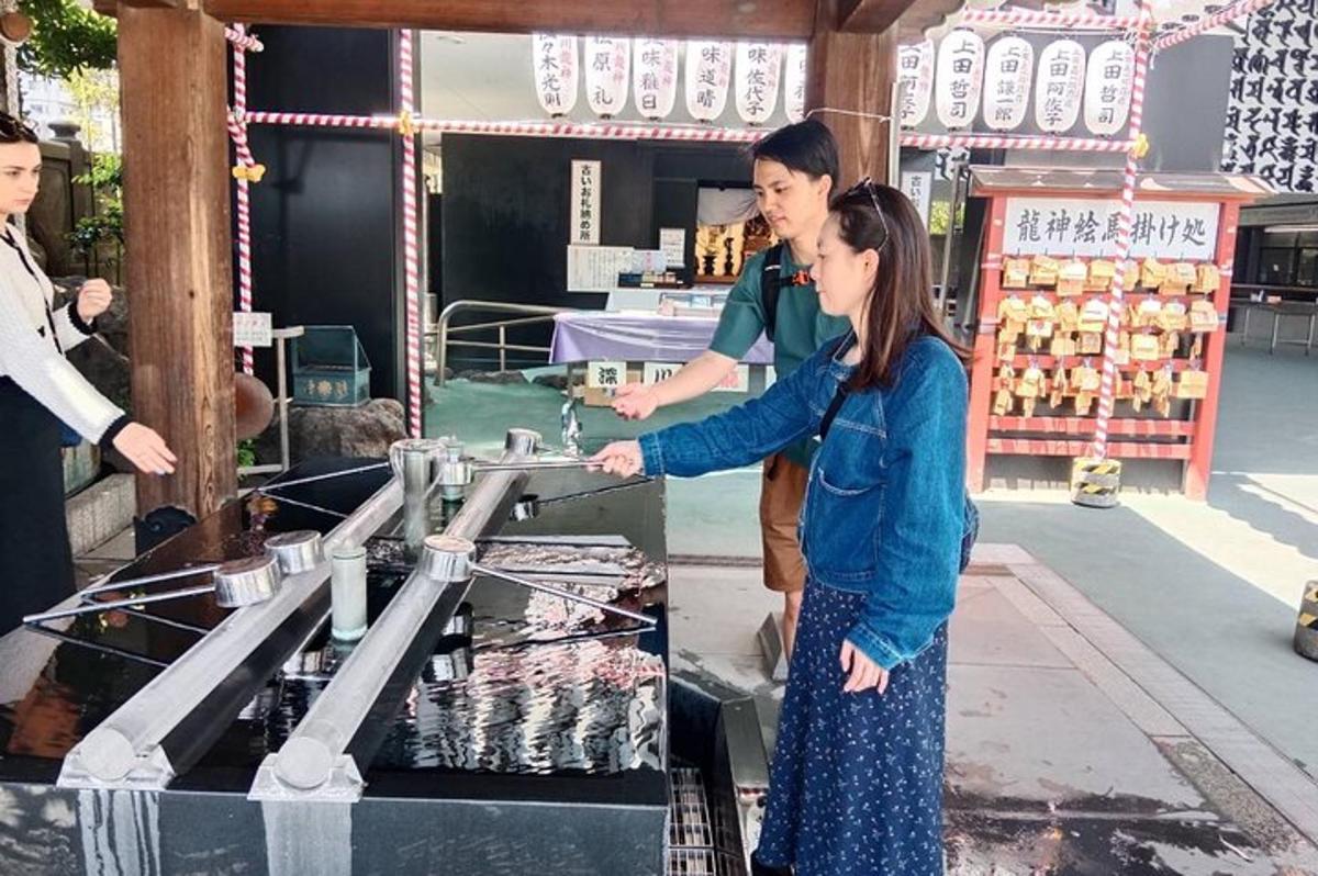 a man and a woman standing in front of a machine