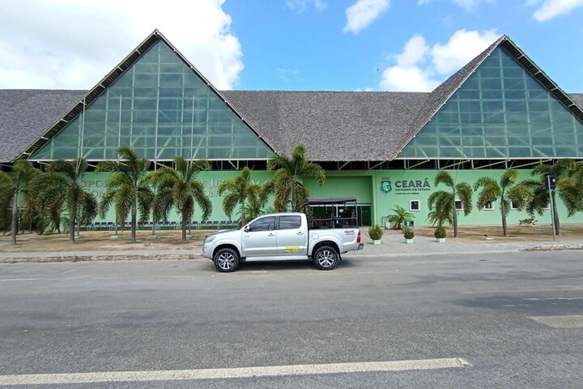 a truck parked in a parking lot in front of a building