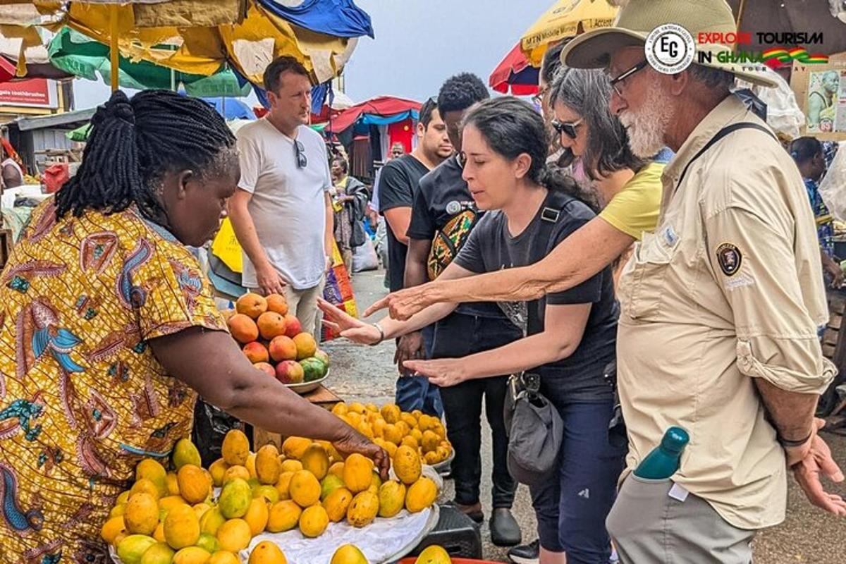 a group of people standing around a market with oranges