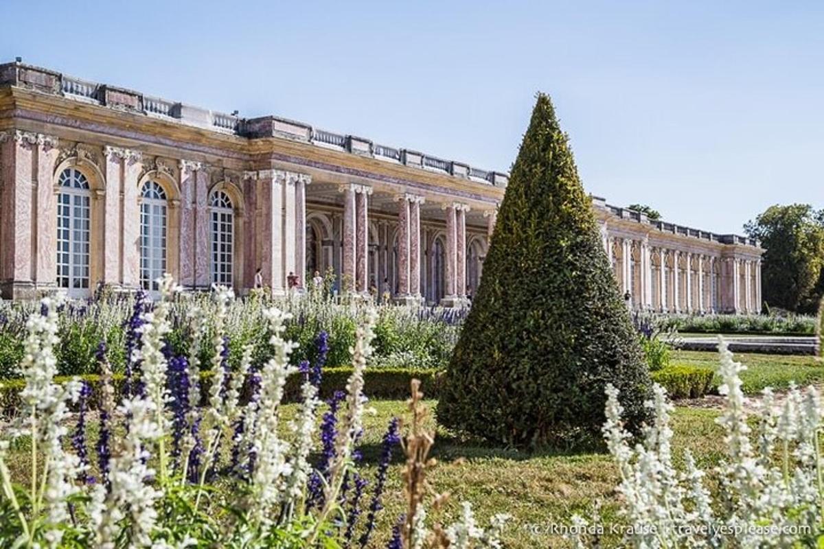 a large building with a garden in front of it