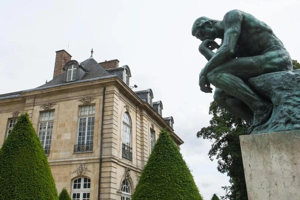 a statue of a woman in front of a building