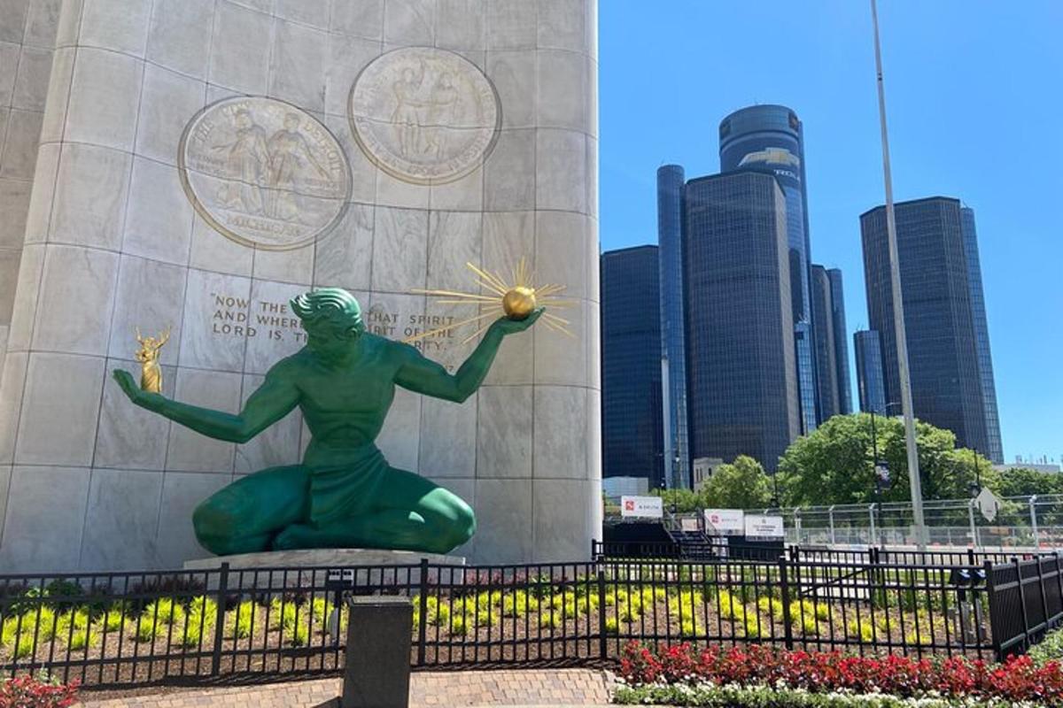 a statue of a woman holding a ball in front of a building