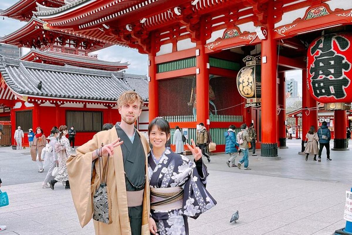 a man and a woman standing in front of a building