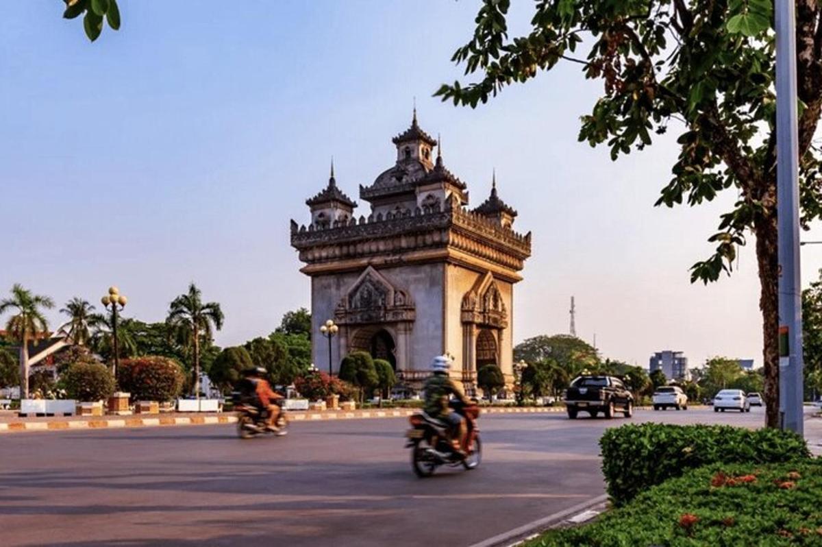 a group of people riding motorcycles down a street