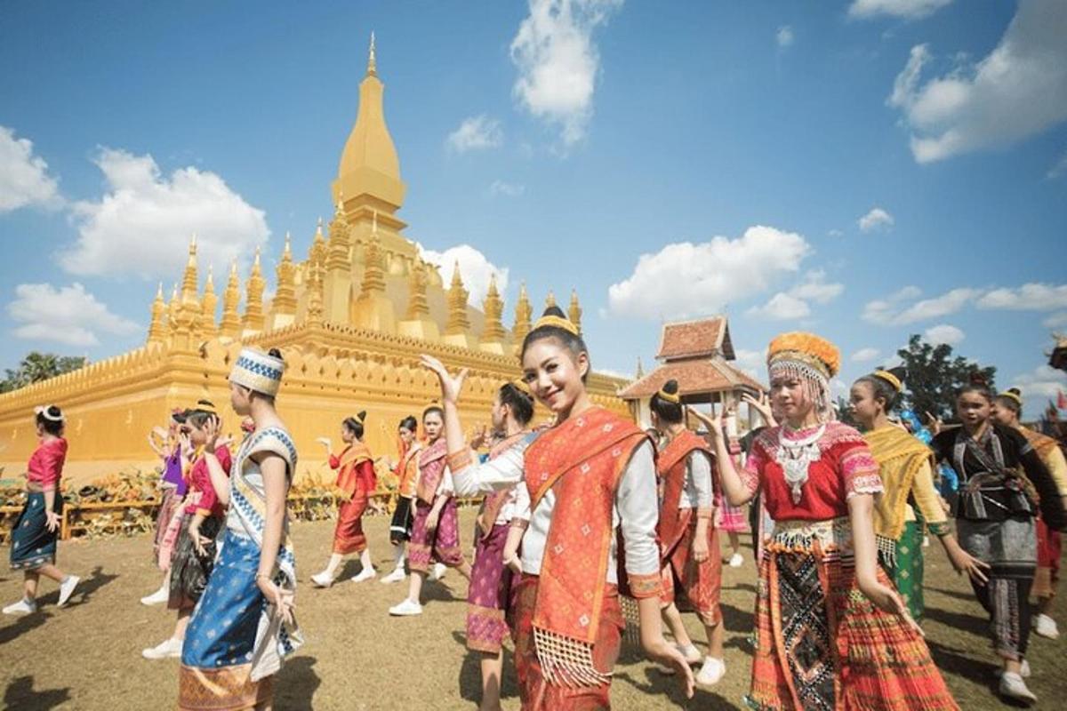 a group of people in traditional costumes in front of a building