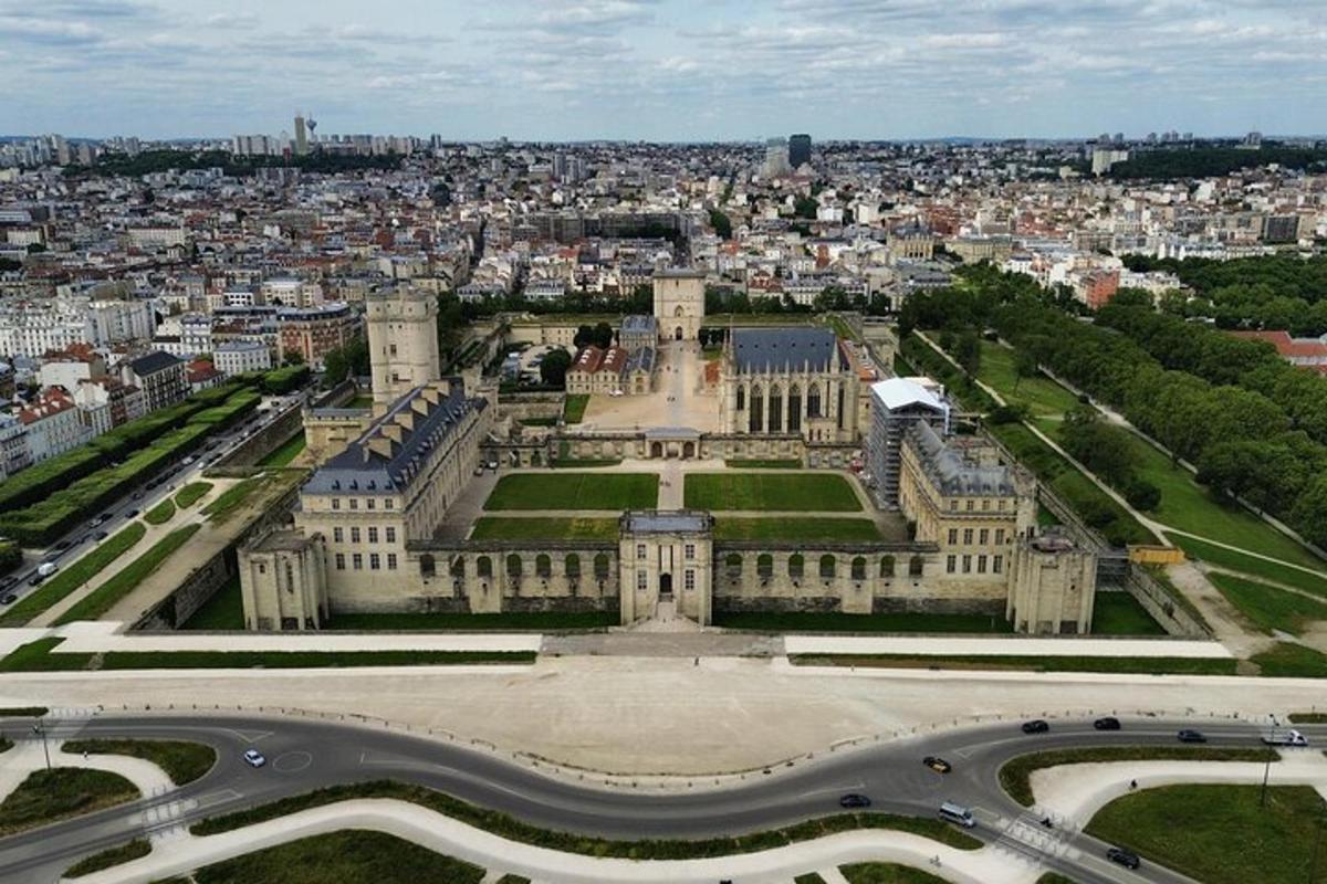 a large building with a city in the background